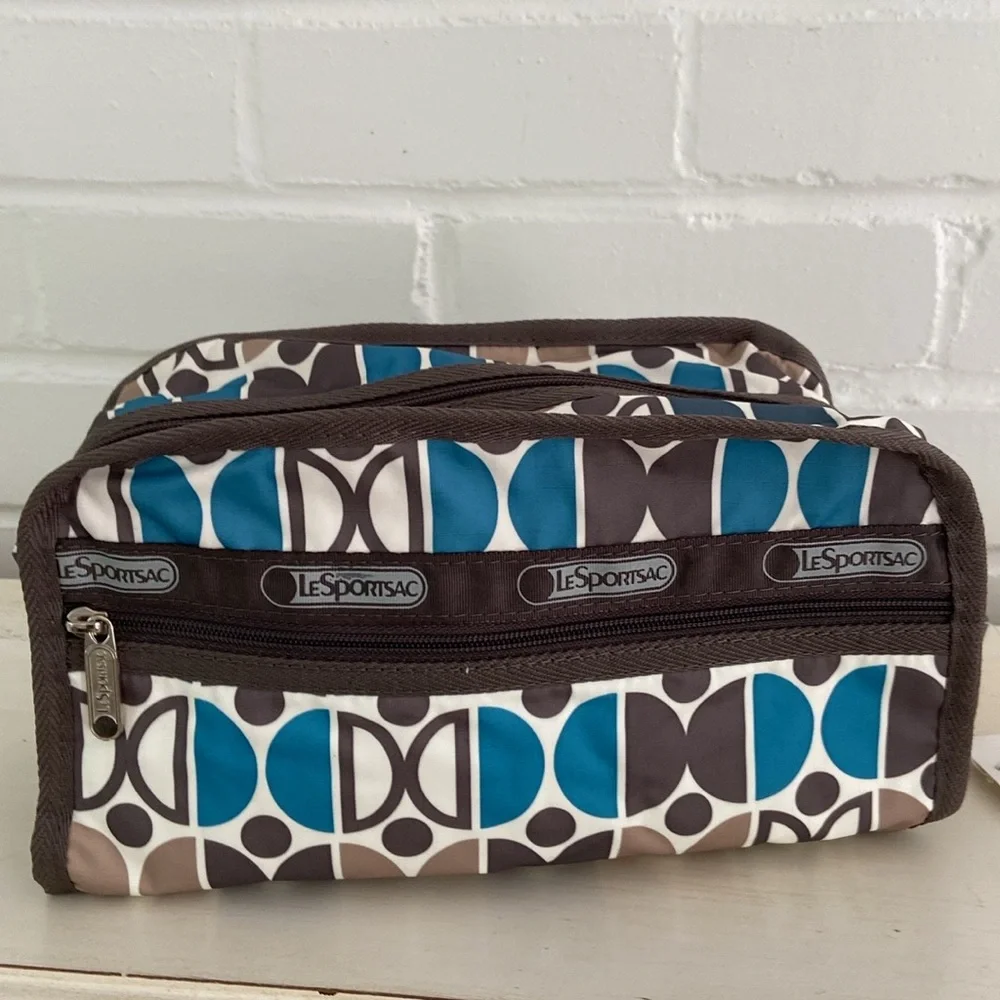 New With Tags LeSportsac Blue/Brown Patterned Cosmetic Travel Overnight Pouch